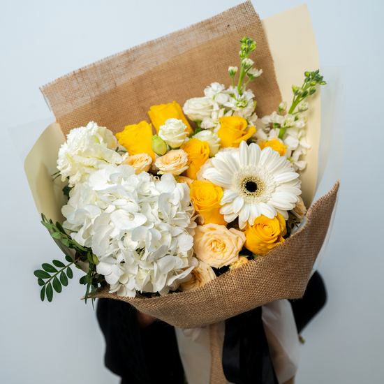 Elegant Sunshine Kiss flower bouquet prepared for flower shop in Dubai