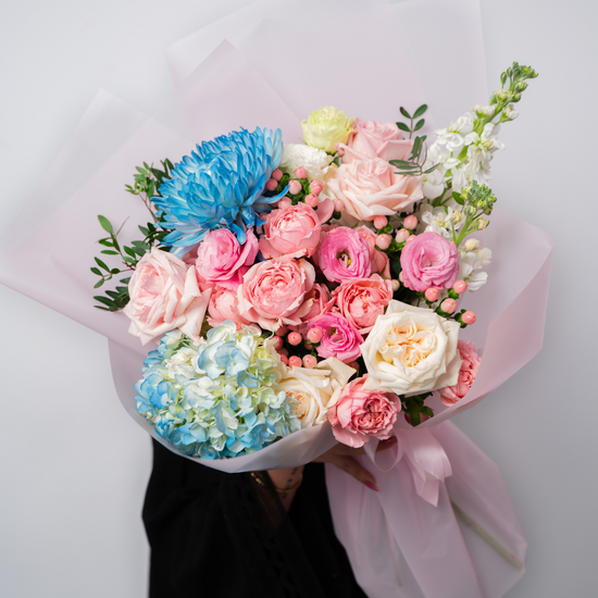 Pastel candy flower bouquet from a flower shop in Dubai with soft pink and pastel blooms