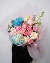 Pastel candy flower bouquet from a flower shop in Dubai with soft pink and pastel blooms